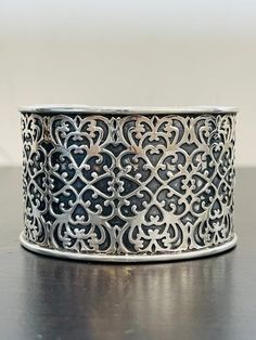 This intricate patterned cuff bracelet is made is sterling silver and is 1 5/8 inches wide.  It is substantial; 60.2 grams!  This bracelet has an arrowhead hallmark and is stamped 925.  This cuff was made in India and is in excellent condition.  SO PRETTY! Flowery Wallpaper, Glendale Az, Pearl And Diamond Ring, Wire Ring, Wire Rings, Filigree Ring, Heart Locket, Bracelet Collection, Silver Cuff