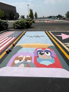 the parking lot is painted with cartoon characters