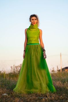 Avant-garde Fitted Skirt For Summer, Green Voluminous Tiered Maxi Skirt, Green Voluminous Long Skirt, Green Full Lined Maxi Skirt, Green Full Maxi Skirt With Lining, Green Flared Maxi Skirt For Party, Green Voluminous Maxi Skirt For Spring, Green Flowy Party Skirt, Chic Green Dress With Voluminous Skirt