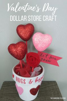 valentine's day dollar store craft with roses and hearts in a cup filled with candy