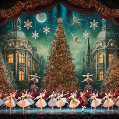 a group of ballerinas on stage in front of a christmas tree