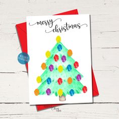 a christmas card with a watercolor tree on it