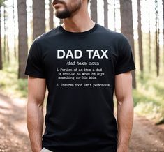 "The \"Dad Tax\" shirt is a perfect funny gift for Father's Day. The shirt is designed with the phrase \"Dad Tax\" and the definition printed on it, which refers to the idea that as a parent, dads are entitled to a portion of their kids' snacks, treats, and meals. The shirt is a hilarious way to celebrate the joy and humor of fatherhood. It is a reminder that dads work hard to take care of their kids, and they deserve a little something in return. So, if you are looking for a fun gift idea for your dad this Father's Day, the \"Dad Tax\" shirt could be the perfect choice! shirt details: This classic unisex jersey short sleeve tee fits like a well-loved favorite. Soft cotton and quality print make users fall in love with it over and over again. These t-shirts have-ribbed knit collars to bols Funny Cotton Shirt Gift, Funny Cotton Shirt As A Gift, Funny Cotton Shirt As Gift, Funny Slogan Shirt For Father's Day, Father's Day Black Shirt With Funny Text, Black Shirt With Funny Text For Father's Day, Funny Text Cotton Shirt For Gift, Custom Text Cotton Shirt For Gift, Funny Shirt For Father's Day Gift