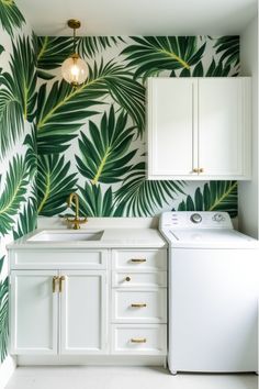 Modern laundry room with large-scale green tropical leaf wallpaper