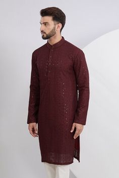 Maroon kurta with thread embroidered floral stripe motifs, embellished by sequins. Comes with a pant. - Aza Fashions Long Sleeve Embellished Kurta For Reception, Embellished Long Sleeve Kurta For Reception, Eid Embroidered Long Sleeve Fabric With Mirror Work, Eid Designer Wear Sequined Embroidered Fabric, Formal Sequined Kurta For Eid, Traditional Formal Kurta With Sequins, Traditional Sequined Kurta For Formal Occasions, Eid Long Sleeve Embroidered Fabric With Mirror Work, Sequin Kurta For Eid Reception