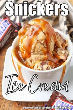 an ice cream sundae with caramel drizzle and snickkers on top