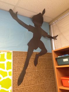 a paper cut out of a person jumping in the air