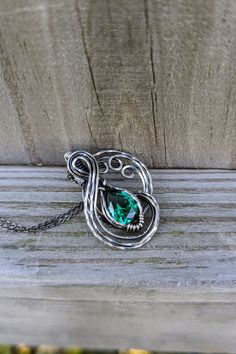 Another day, and another beautiful piece is in shop. This is a teal cubic zirconia wrapped in silver filled wire, and oxidized. I love how this piece turned out. Mythical, yet royal looking. It is a unique piece and I now have it available in my Etsy. Oxidized Pendant Jewelry For Anniversary, Oxidized Finish Pendant Jewelry For Anniversary, Anniversary Oxidized Pendant Jewelry, Unique Silver Necklace For May Birthstone, Anniversary Oxidized Pendant Necklace, Unique Emerald Necklace As Gift, Unique Pewter Jewelry For Gifts, Unique Pewter Necklace As Gift, Unique Pewter Necklace For Gift