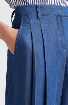 Crisp pleats lend tailored structure to otherwise breezy pants cut in a wide-leg silhouette that brings runway-worthy movement to every step you take. 34" inseam; 33" leg opening; 11 1/2" front rise; 16" back rise (size 6)   Zip fly with hook-and-bar closure   Front slant pockets; back welt pocket   100% Tencel® lyocell   Tencel lyocell is a sustainably produced fiber made with closed-loop processing   Machine wash, dry flat   Made in the USA of imported fabric Pocket Design Fashion Style, Pants Pocket Design, Pant Silhouettes, Welted Pocket, Tailor Pants, Structured Pants, Inseam Pocket, Pocket Design Fashion, Pants With Pleats