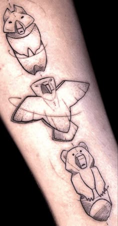 an arm with some drawings on it and two bears in the middle one is holding a knife