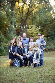 a family posing for a photo in front of some trees with the words, happy anniversary