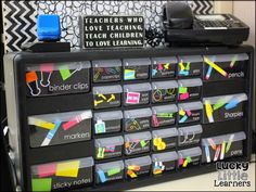 a black and white desk with lots of school supplies on it's display shelf