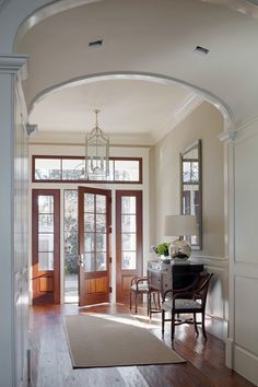 an archway leads to the dining room and foyer