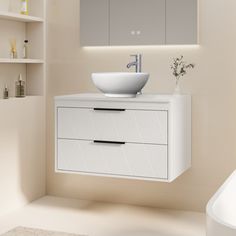 a white sink sitting under a bathroom mirror next to a bath tub and counter top