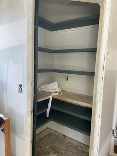 an empty room with some shelves in it