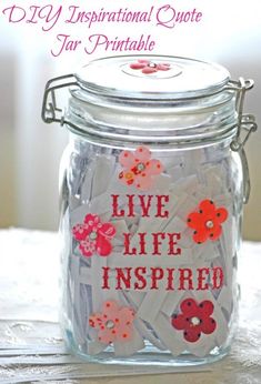 a glass jar with some stickers on it and the words live life inspired written in red