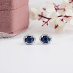 Sapphire Oval Gemstone Stud Earrings, Lab Grown Round Diamond Halo Earrings, Screw Back Diamond Stud Earrings, Ready To Ship Gemstone Earrings, Gemstone Stud Earrings For Women's, Hand Made Diamond Minimalist Jewelry, Gemstone Jewelry Collection By Ouros Jewels ● SKU: OJS0455 ● 𝐂𝐞𝐧𝐭𝐞𝐫 𝐃𝐢𝐚𝐦𝐨𝐧𝐝 𝐃𝐞𝐭𝐚𝐢𝐥𝐬  Type - Lab Grown Gemstone Shape - Oval  Total Carat Weight - 1.60 CT Color - Blue Sapphire ● 𝐒𝐢𝐝𝐞 𝐃𝐢𝐚𝐦𝐨𝐧𝐝 𝐃𝐞𝐭𝐚𝐢𝐥𝐬 Type - Lab Grown Diamond Shape - Round Brilli Diamond Halo Earrings, Round Diamond Halo, Halo Diamond Earrings, Earrings Gemstone, Halo Earrings, Gemstone Stud Earrings, Gemstone Studs, Diamond Stud Earrings, Diamond Stud