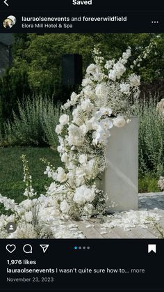 an arrangement of white flowers is on display in the garden with text that reads, saved