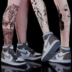 two legs with tattoos and sneakers on them