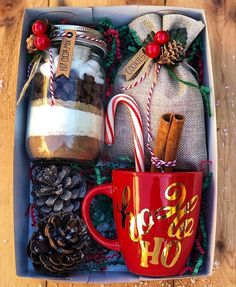 a christmas gift box filled with coffee, candy canes and cookies