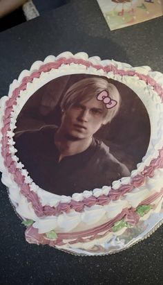 a birthday cake with an image of a person on it