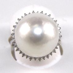 This Is A Fancy Fine Huge South Sea Pearl Solitaire Ring W/Diamond Halo. It Is Made Of 100% Natural 14kt White Gold And Is In Brand New Condition. The Size Of The Pearl Is 16.5 Mm, It Has A Ctw Of 0.40ct And Weighs 10.0 Grams. The Fancy Diamonds Have A Clarity Of Si1 And F Color. This Beautiful Custom Piece Has An Excellent Huge Round Pearl Stone, Surrounded By A Diamond Halo. This Ring Is The Latest In Fashion Design Having Unique Designer Qualities That Is Full Of Shine And Clarity. White 14k Gold Jewelry With Single Cut Diamonds, White 14k Gold Jewelry With Brilliant Cut, White Pear-shaped Ring With Single Cut Diamonds, Classic White Jewelry With Single Cut Diamonds, Dazzling White Platinum Jewelry, Exquisite 14k White Gold Jewelry, Classic White Pearl Ring With Diamond Accents, Timeless White Gold Pearl Ring With Diamond Accents, Formal Brilliant Cut Pearl Ring In Platinum