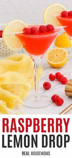 raspberry lemon drop cocktail in coupe glasses garnished with fresh raspberries