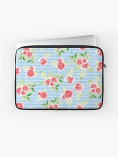 a laptop case with roses on it and blue stripes around the bottom, in front of a white background