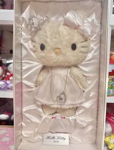 a hello kitty stuffed animal in a box