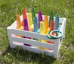 a box filled with lots of different colored bottles next to the words, bottle ring toss game take the fun and games outside this summer