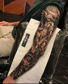 a man with a tattoo on his arm