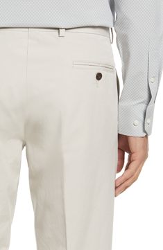 Lightweight Japanese cotton poplin defines clean-cut dress pants in a smart flat-front design. 17 1/2" leg opening; 11 1/4" front rise Zip fly with button closure Side-seam pockets; watch pocket; back button-welt pockets Unlined 100% cotton Machine wash, tumble dry Imported Slim Fit Cotton Chinos For Summer, Fitted Semi-formal Chinos With Pockets, Fitted Chinos For Semi-formal Occasions, Fitted Chinos With Pockets For Semi-formal Occasions, Summer Slim Fit Cotton Chinos, Classic Fitted White Chinos, Fitted Classic White Chinos, White Fitted Classic Chinos, Fitted Chinos For Spring Business Wear