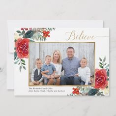 a christmas card with an image of two adults and two children in front of them