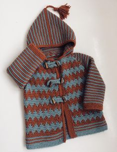 a knitted jacket with a hood on it