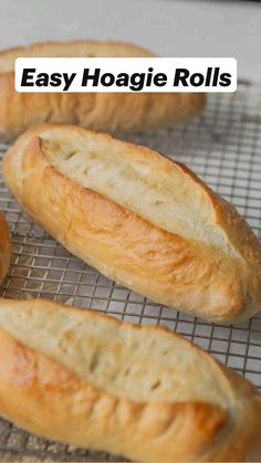 four loaves of bread cooling on a wire rack