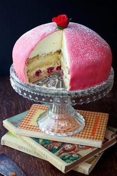 a cake that has been cut in half and is on top of a glass platter