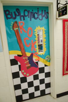 a door decorated with a guitar and checkered floor