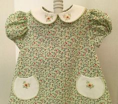 "Sweet little Dress, Size 1. The Dress is  100% Cotton and has a  Poly Cotton Peter Pan Collar and Fully lined READY TO SHIP!   It is truly a comfortable little dress.  The lining helps to keep wrinkles to a minimum and looking fresh.  It measures 9\" across the shoulders and 18\" long. It is handmade, including the embroidery on the Peter Pan Collar and little pockets. Easy to secure with buttons in the back. The Fabric is 100% Cotton. Contact me with any questions!" Cute Smocked Short Sleeve Dresses, Cute Green Smocked Dress, Cotton Smock Dress With Peter Pan Collar, 60s Mod, Baby Sister, Smocked Dress, Little Dresses, Pan Collar