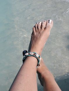 "Cowrie Shell Beaded Anklet Beach Wedding Boho Jewelry                                                  Eclectic ethnic, tribal-inspired boho chic jewelry, crocheted, handcrafted in Queens, NY. Listed here; Anklet with a loop-knob closure- measuring 10¾\", with 11 shells $ 142 beads Both pieces are 1\" wide. In the last 2 photos the anklet is pictured with the matching choker - see the Jewelry Section for more! Please CONTACT me for a custom piece! These are my original designs, inspired by ethn Bohemian Turquoise Beaded Bracelets For Beach, Hippie Beaded Bracelets For Beach, Summer Beach Macrame Beaded Bracelets, Bohemian Beaded Strand Anklets, Turquoise Beaded Bracelets For Beach In Hippie Style, Turquoise Bohemian Beaded Bracelets For Beach Season, Bohemian Beaded Bracelets For Beach, Traditional Turquoise Bracelets For Beach, Adjustable Fair Trade Beaded Bracelets For Beach