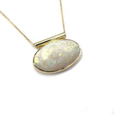 '- 24x15 mm white opal cabochon- hand made bezel setting- 46 cm (18") chain- polished gold finish- hand crafted from recycled 18k yellow gold in April 2024 in Seattle, WA. Silver Gold Necklace, Faberge Jewelry, Fancy Necklace, Tourmaline Necklace, Handcrafted Necklace, April 2024, Opal Necklace, Quartz Necklace, Recycled Sterling Silver