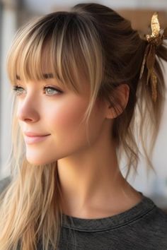 This is an easy and chic hairdo of a casual low ponytail with wispy bangs. Suited for medium to long-length hair, this look pulls your locks back tenderly and lets soft, wispy bangs gracefully frame the face. Click here to check out more trending wispy bangs hairstyles to try this year. Hairstyles With Wispy Bangs, Soft Wispy Bangs, Bold Bangs, 50 Hairstyles, Summer Hair Trends, Full Fringe, Wolf Haircut, Long Length Hair