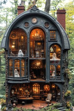 an elaborate doll house in the woods with lots of windows and furniture on it's sides