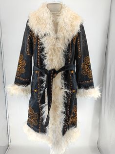 This is hand embroidered mongolian shearling trimmed black suzani coat.  What is materials ? - Natural mongolian shearling trimmed.  - interior lining is factory wool. İt keeps warm.  - Outside material is embroidery suzani talestry.  What is length ?  - 43 inches. 110 cm.  What is custom made ? - We can make similar coat, length as you want, diffirent fur colour, and custom sizes.  Where is it made ? - Made in Turkiye.  Do they run small or big ? - Please select your regular size. We just add b Vintage Embroidered Outerwear For Costume, Vintage Embroidered Costume Outerwear, Traditional Black Outerwear For Costume, Traditional Black Costume Outerwear, Mother Days, Embroidery Coat, Unique Boots, Trim Jacket, Coat Vintage