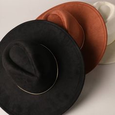 Wide Brim Suede Feel Fedora Hat -Accented gold belt -Wide flat brim (3.75 " ) -Adjustable string inside band - 100% Polyester ** One Size Fits Most ** Make a statement with our gold belt wide flat brim suede fedora hat. This luxurious hat features a rich suede texture that adds a touch of sophistication and elegance. The wide, flat brim provides ample sun protection and a bold, contemporary look. Accentuated with a gleaming gold belt around the crown, this hat combines classic fedora style with Chic Gold Wide Brim Fedora, Elegant Brown Wide Brim Fedora, Classic Gold Flat Brim Fedora, Trendy Brown Wide-brim Felt Hat, Elegant Brown Wide-brim Fedora, Fedora Style, Suede Texture, Belt Wide, Gold Belt