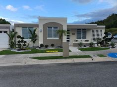 a house that has grass in front of it