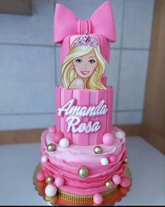 a barbie doll birthday cake with pink frosting