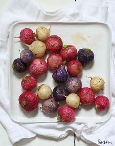 a white plate topped with different types of fruits