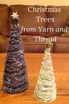 two christmas trees made from yarn and thread on a table with the words, christmas trees from yarn and thread