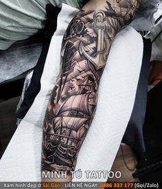 a man with a black and white tattoo on his arm