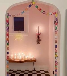 a room decorated with candles and decorations